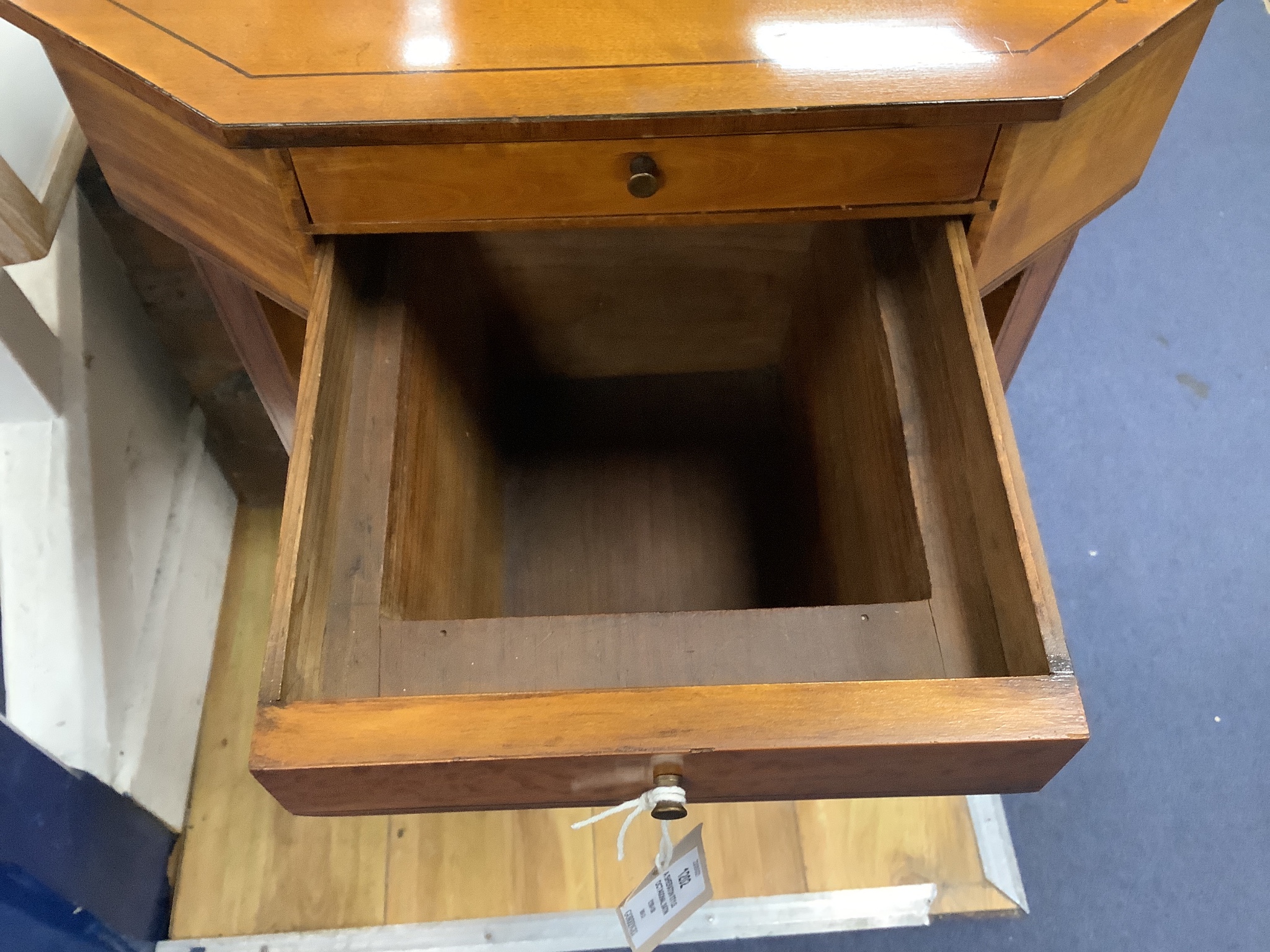 A Sheraton style octagonal satinwood sewing table. W-41, D-33, H-73cm.